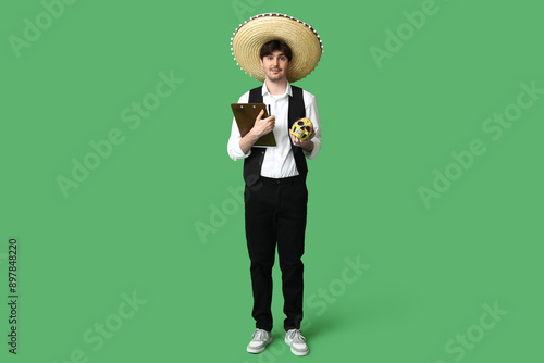 Young male waiter with somb...