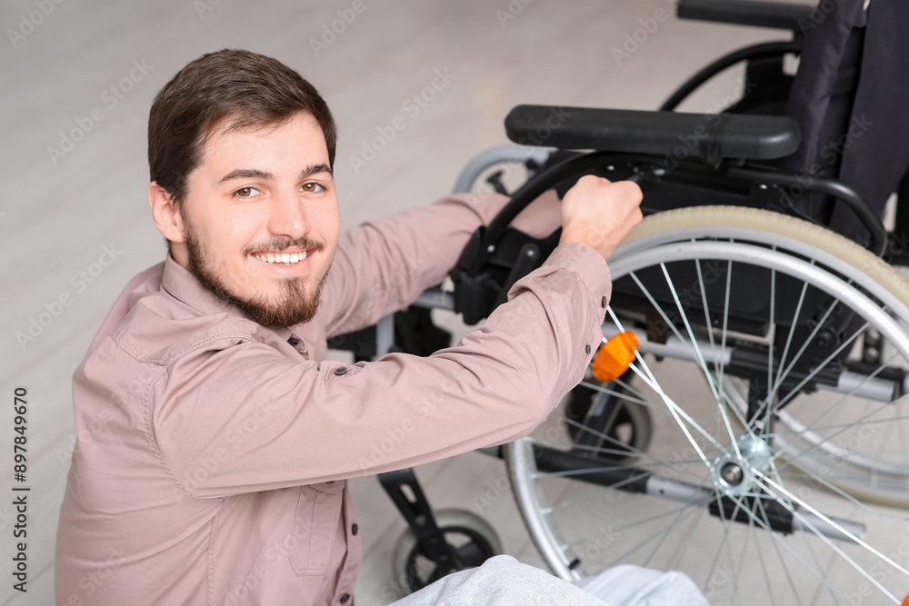 Young man repairing wheelchair at home, closeup Young man repairing wheelchair at home, closeup