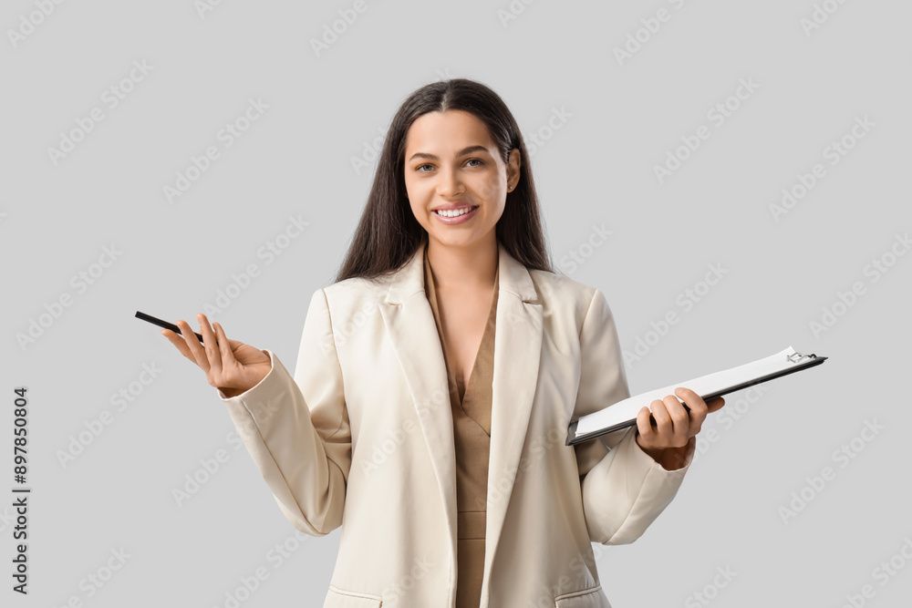 Pretty businesswoman with laptop and pen on white background Pretty businesswoman with laptop and pen on white background