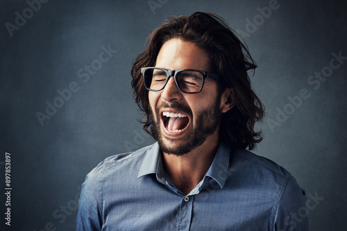 Scream, business and man in studio for frustration, company problem or bad news on gray background. Shouting, entrepreneur and corporate employee with anger for burnout, deadline or project mistake