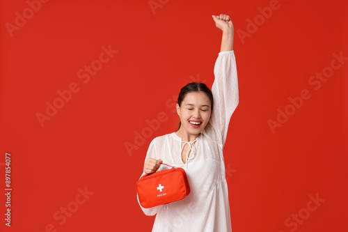 Happy young Asian woman wit...