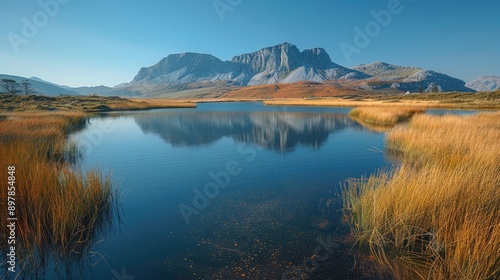 Obraz na płótnie Tranquil lake reflecting distant mountains w salonie
