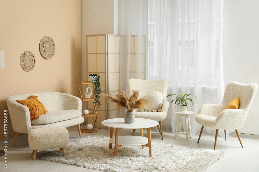 Fototapeta premium Comfortable sofa, armchairs and coffee table in interior of living room