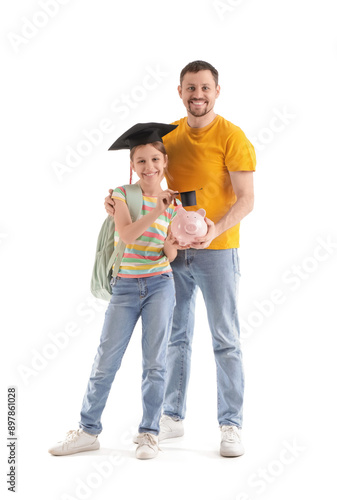 Education savings and college fund, father and daughter with piggy bank and g...
