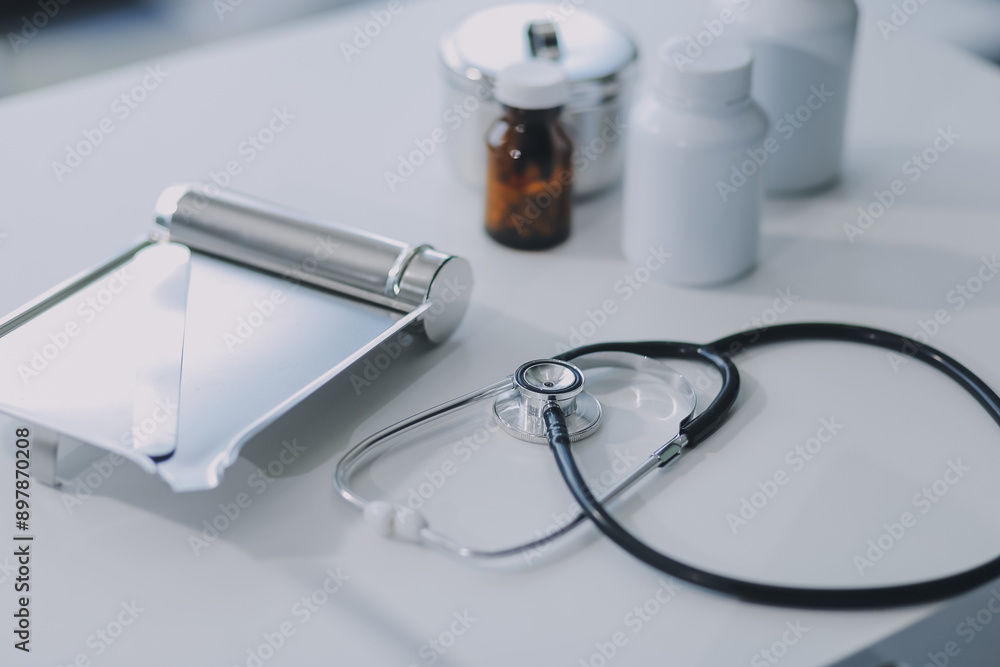 Health care billing statement with stethoscope, bottle of medicine for doctor's work in medical center stone background. Health care billing statement with stethoscope, bottle of medicine for doctor's work in medical center stone background.