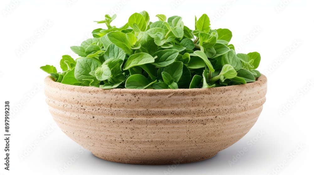 Dried Mexican Oregano Leaves in a Small Bowl on a White Background Dried Mexican Oregano Leaves in a Small Bowl on a White Background