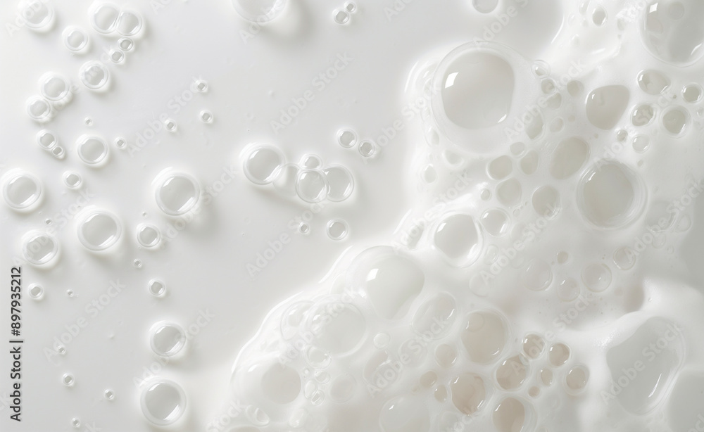 Close-up of white foam bubbles with varying sizes. Close-up of white foam bubbles with varying sizes.