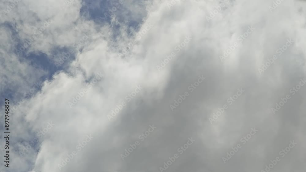 clear sunny blue sky with running fast huge white clouds by strong wind clear sunny blue sky with running fast huge white clouds by strong wind