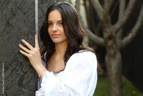 KYITeenage girl posing for a photographer. Young and beautiful teenage girl.