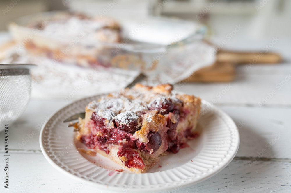 Piece of delicious sweet casserole with cherries. Delicious german summer dessert called Kirschen Michel Piece of delicious sweet casserole with cherries. Delicious german summer dessert called Kirschen Michel