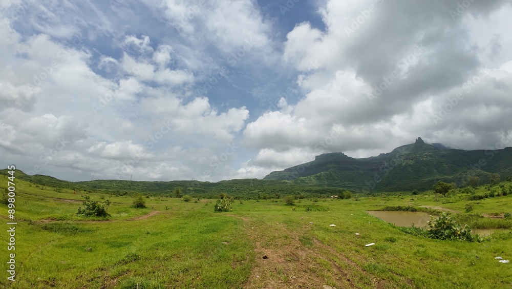 Peaceful plains surrounded by lush greenery and hills Peaceful plains surrounded by lush greenery and hills