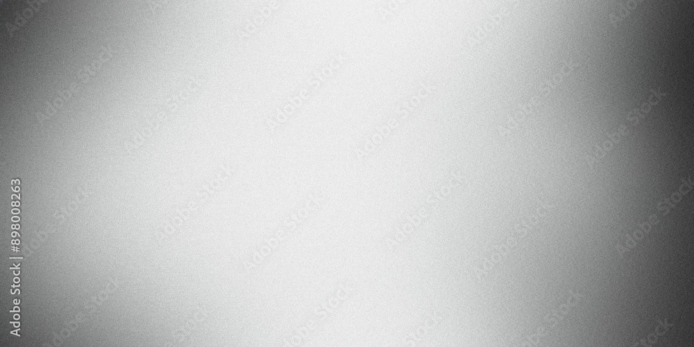 Abstract silver background with fine grain texture showing light reflections and a radial gradient Abstract silver background with fine grain texture showing light reflections and a radial gradient