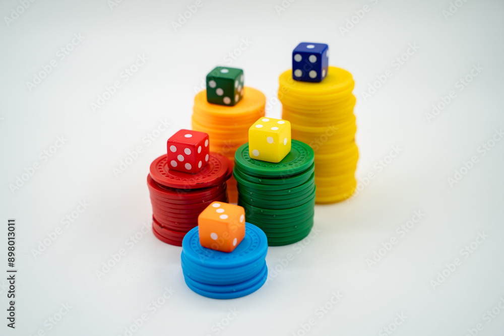 Colourful poker chips with dices isolated over white background. Colourful poker chips with dices isolated over white background.