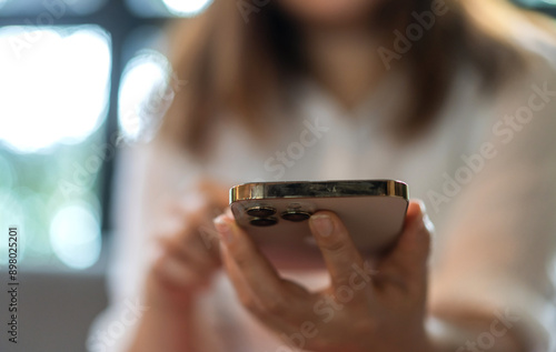 Person using modern smartphone device, engaged with phone, texting, browsing or using app, technology, communication mobile apps, social media and modern lifestyles, advertisements, tech blogs, media