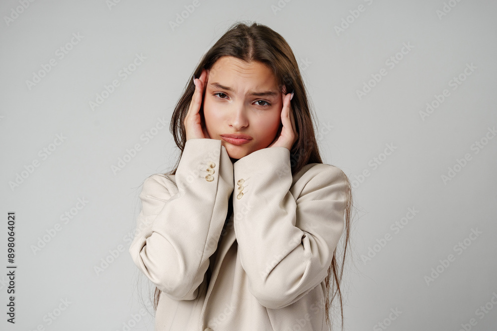 Emotional worried young female in casual clothes Emotional worried young female in casual clothes