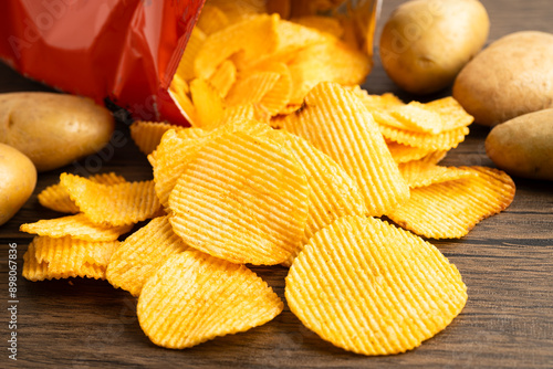 Φωτογραφία Potato chips fried snack fast food in open bag.