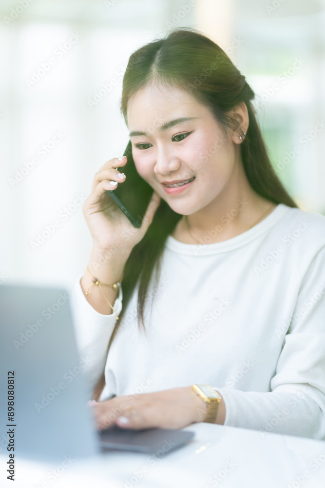 Happy of asian freelance people business female talking making using smartphone casual working with laptop computer and coffee cup in at the cafe, Business Lifestyle communication concept Happy of asian freelance people business female talking making using smartphone casual working with laptop computer and coffee cup in at the cafe, Business Lifestyle communication concept