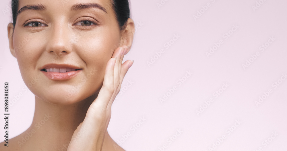 Beautiful Young Woman with Radiant Skin Touching Her Face Beautiful Young Woman with Radiant Skin Touching Her Face