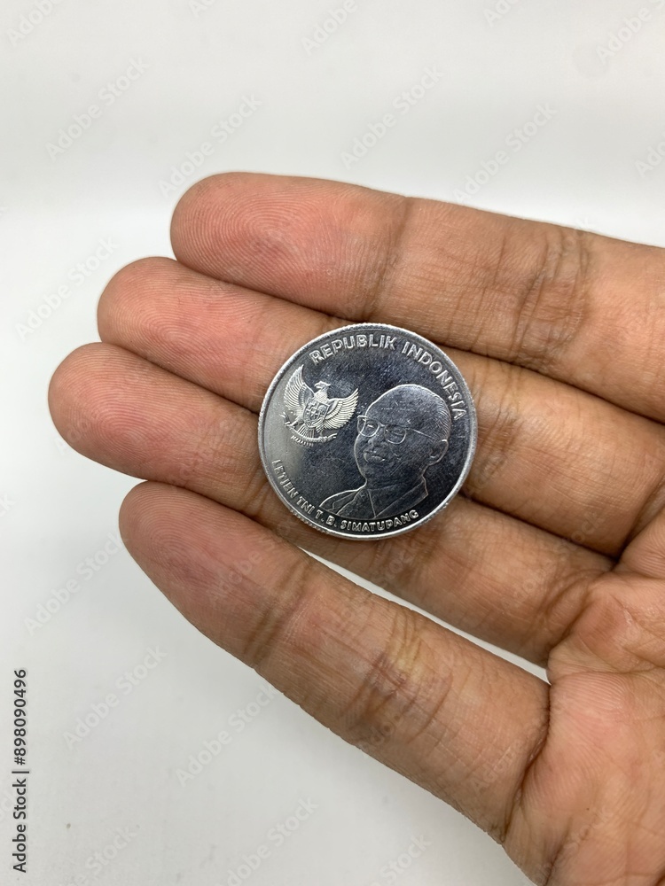 pile of coins in Indonesian rupiah from personal savings pile of coins in Indonesian rupiah from personal savings