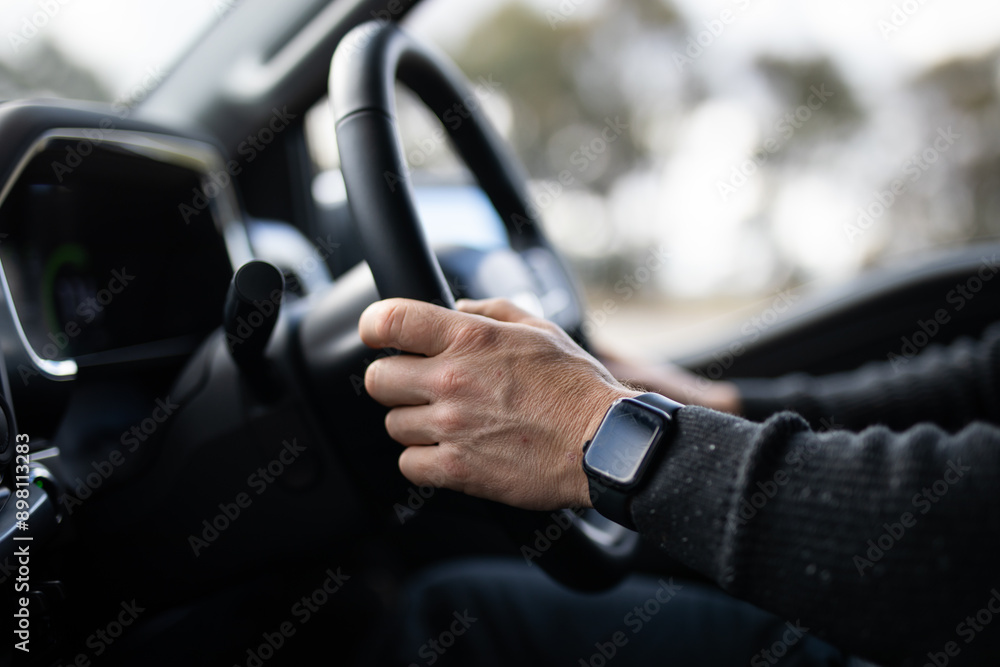male caucasian hand driving car steering watch jumper destination holiday work male caucasian hand driving car steering watch jumper destination holiday work