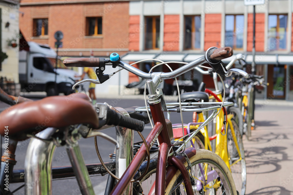 KRAKOW, POLAND - JULY 20, 2024: .Many colorful bicycles parked on a historic street in Kazimierz, Krakow.