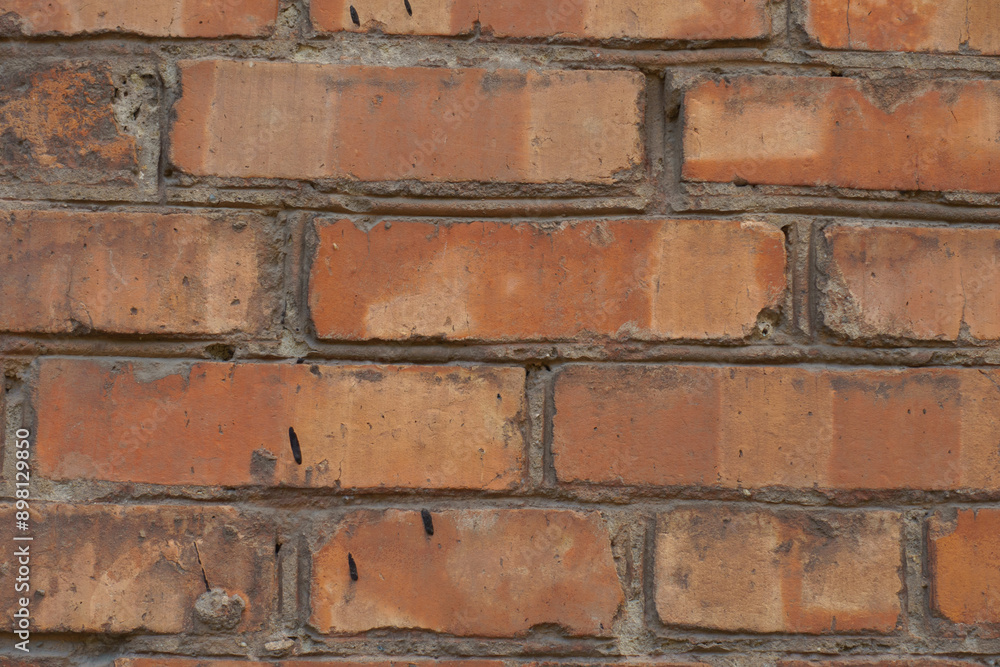 Fototapeta premium Macro of red brick wall with standard stretcher bond