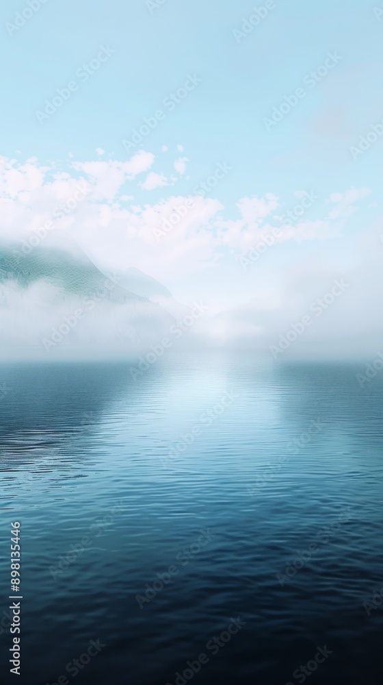 Fototapeta premium Lake merging into a mist, calm water, blue tone.