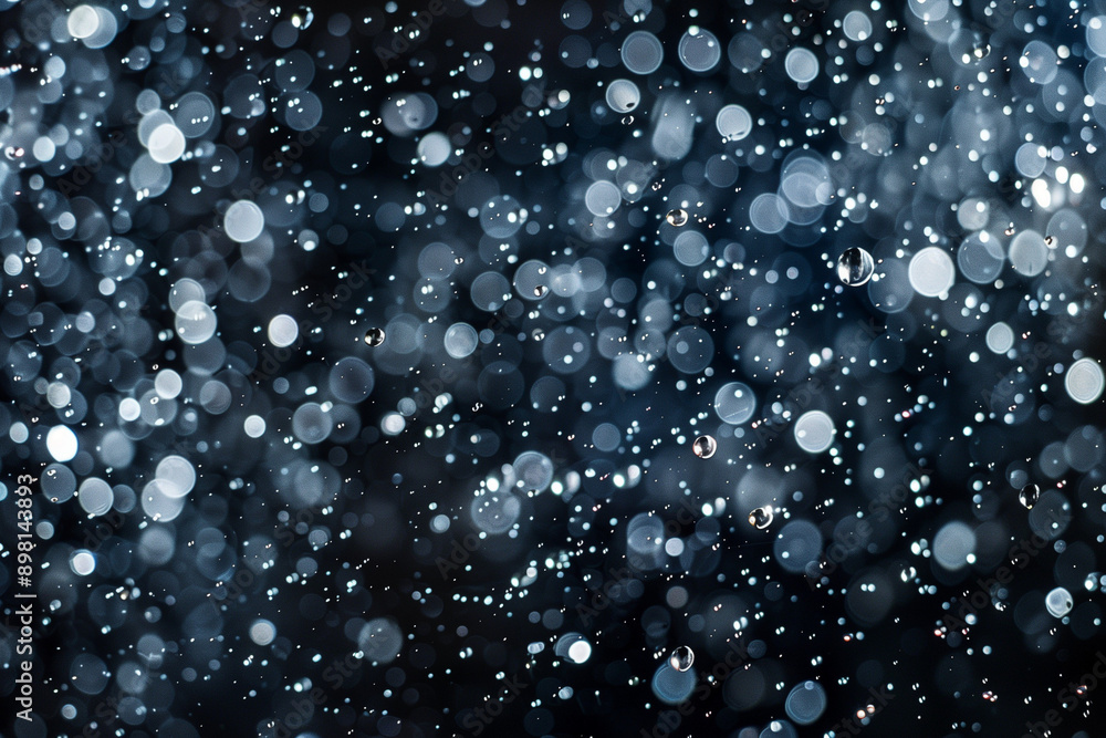 Water drops on black background, texture, bokeh in the background Water drops on black background, texture, bokeh in the background