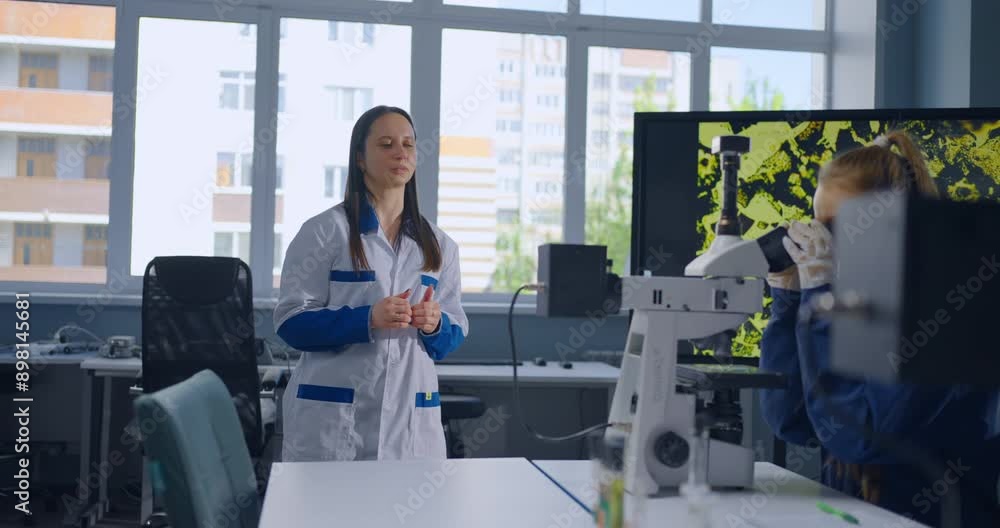 Students Looking Through Microscope And Teacher Explaining Chemical Structure Of Materials Students Looking Through Microscope And Teacher Explaining Chemical Structure Of Materials