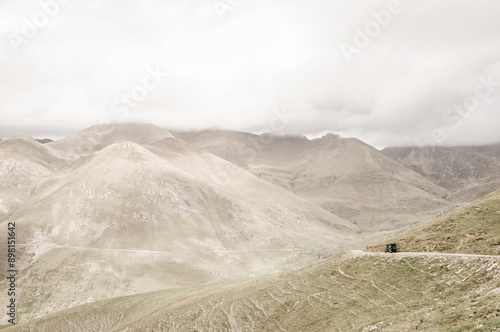 pyrenees, andorra - 09.11.18 - offroad vehicle passes a mountain section photo