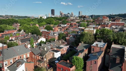 Historic brick rowhouses in Pittsburgh neighborhood. Aerial view of housing near downtown city in Pennsylvania during summer. photo