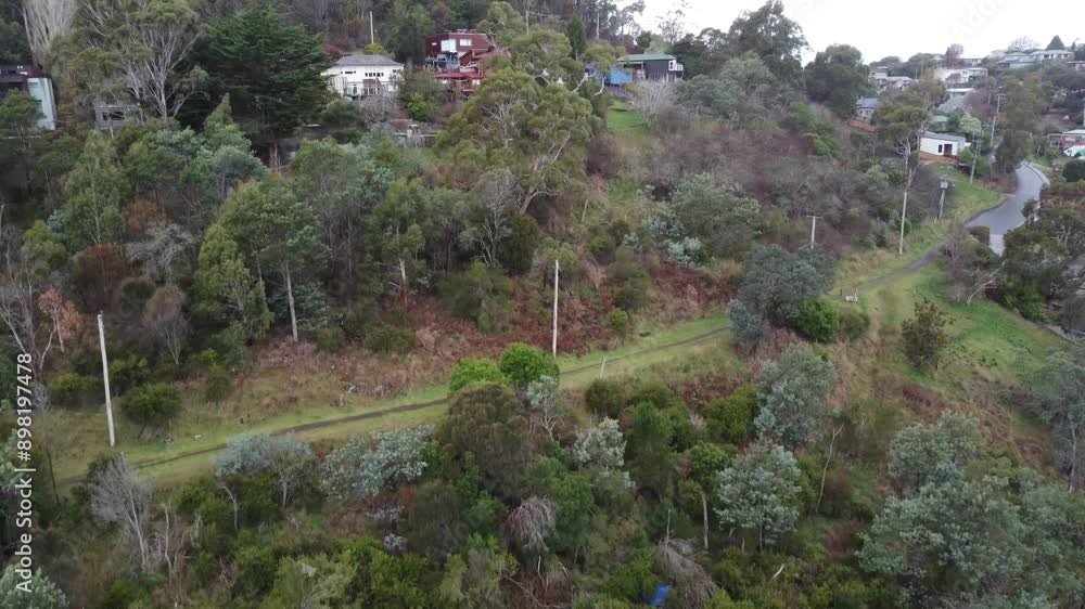 Drone descending in a small Australian town in the Mountains Drone descending in a small Australian town in the Mountains