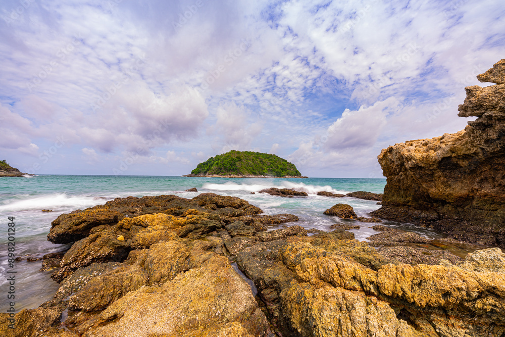 .Around the island there are large rocks surrounding it. When a big wave hits, the water splashes and bursts into tall foam, looking beautiful and frightening. sandbars connect to the island... .Around the island there are large rocks surrounding it. When a big wave hits, the water splashes and bursts into tall foam, looking beautiful and frightening. sandbars connect to the island...