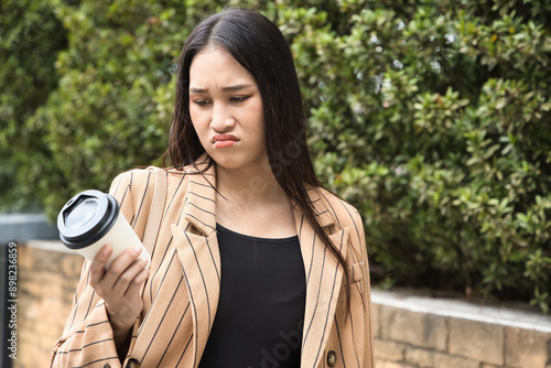 Konstfotografi Unhappy and angry office worker woman not feeling satisfying after tasting bad t