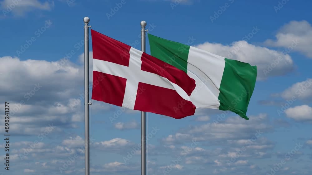 Nigeria and Denmark flags flying together, video concept of the relationship, two country relations concept Nigeria and Denmark flags flying together, video concept of the relationship, two country relations concept