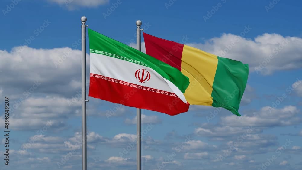 Republic of Guinea or Guinea-Conakry and Iran flags flying together, video concept of the relationship, two country relations concept Republic of Guinea or Guinea-Conakry and Iran flags flying together, video concept of the relationship, two country relations concept
