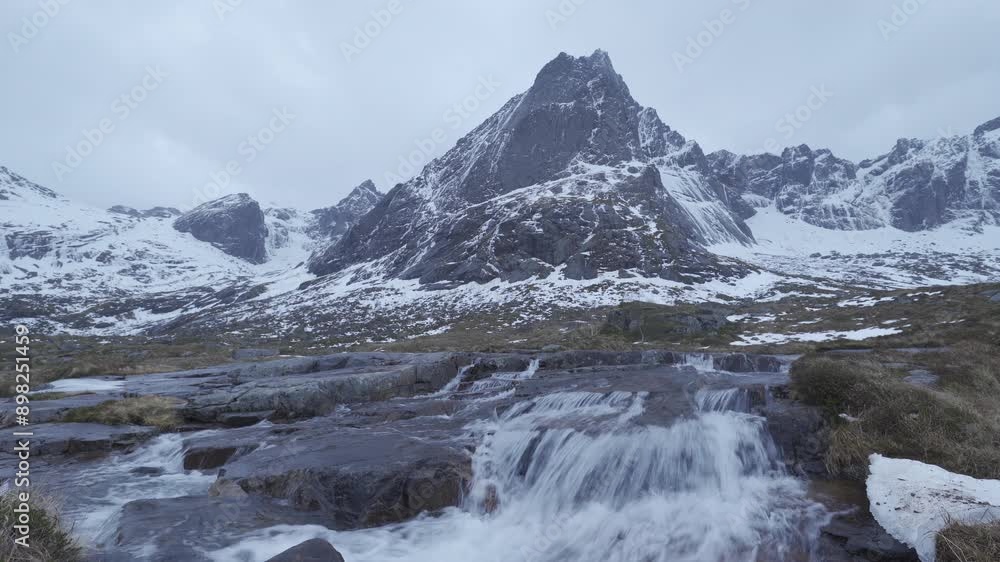 White snow mountain in Lofoten islands, Nordland county, Norway, Europe. Hills and trees, nature landscape in winter season. Winter background. White snow mountain in Lofoten islands, Nordland county, Norway, Europe. Hills and trees, nature landscape in winter season. Winter background.