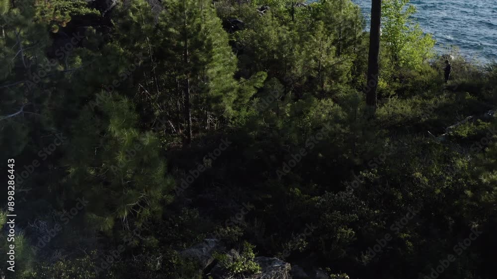 Drone tilt up revealing the large freshwater lake Lake Tahoe in the Sierra Nevada Mountains Drone tilt up revealing the large freshwater lake Lake Tahoe in the Sierra Nevada Mountains