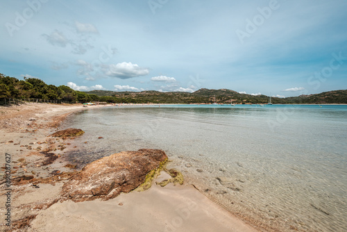 Sunshine, sand and azure Mediterranean sea at Rondinara beach on the south east coast of the island of Corsica photo