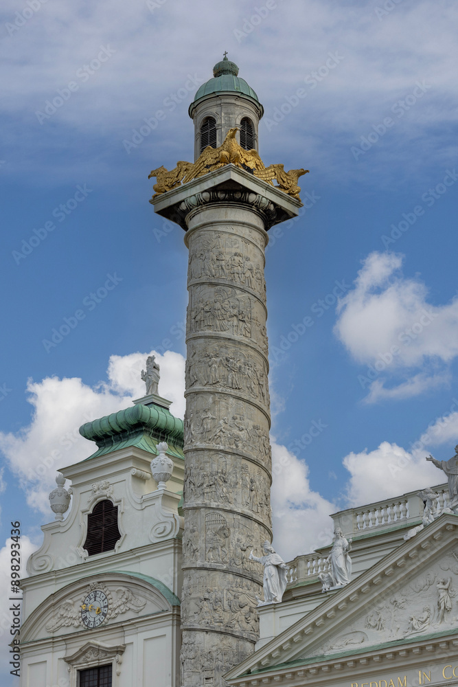 Column with spiral narrative of baroque Karlskirche church located on Karlsplatz, Vienna, Austria