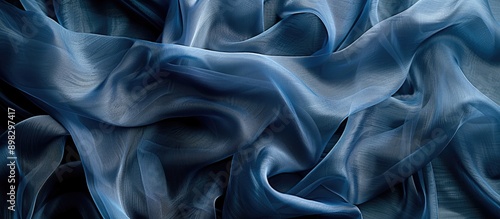 Abstract blue silk chiffon fabric with an artistic denim silk taffeta color layout on a background template with copy space image