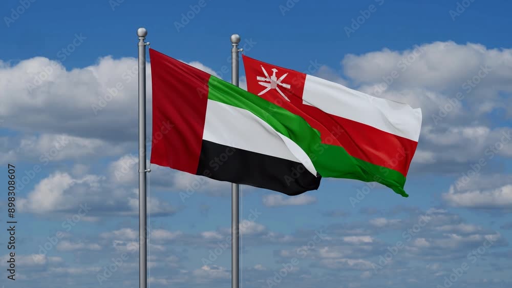 Oman and United Arab Emirates flags flying together, video concept of the relationship, two country cooperation concept Oman and United Arab Emirates flags flying together, video concept of the relationship, two country cooperation concept