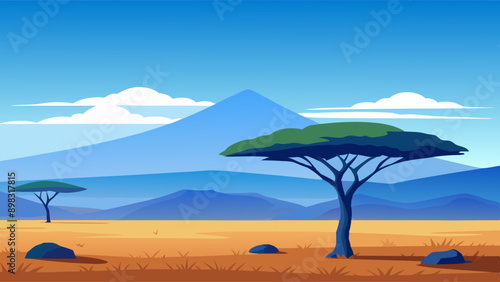 African savannah landscape with trees, rocks, and open grassland under a clear blue sky