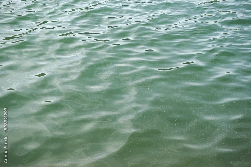 Smooth surface of water on a mountain lake. Smooth surface of water on a mountain lake.