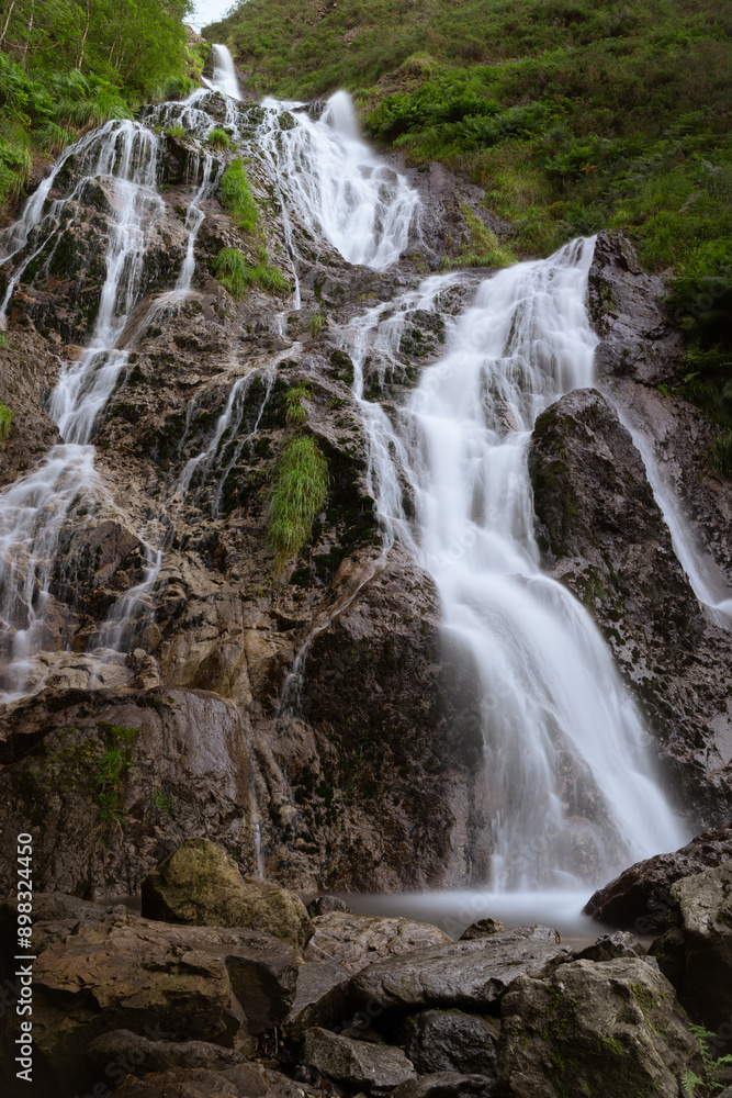 Fototapeta premium The Aitzondo waterfall, the most important waterfall in Gipuzkoa and one of the largest in the Basque Country with lots of water flowing at full speed.