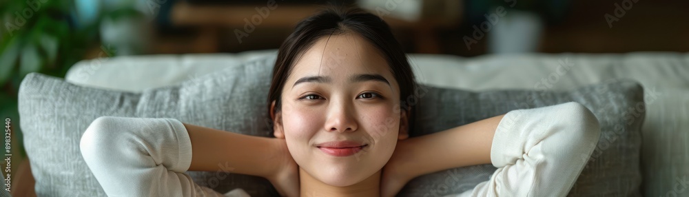 Happy Woman Relaxing on a Couch with a Big Grin, Self-Assured and Content, Relaxed Pose, Smiling, Joy, Happiness, Comfort, Positive Energy, Wellbeing, Smiling Face, Joyful Expression, Home, Comfort Happy Woman Relaxing on a Couch with a Big Grin, Self-Assured and Content, Relaxed Pose, Smiling, Joy, Happiness, Comfort, Positive Energy, Wellbeing, Smiling Face, Joyful Expression, Home, Comfort