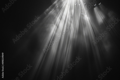 Intense beams of light cutting through the darkness  A grayscale image of a sunbeam piercing through the overcast sky  AI generated