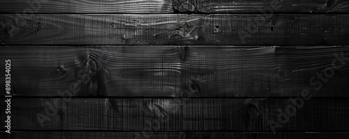 Elegant black wooden floors laid out horizontally, serving as a sleek and modern backdrop for website or wallpaper designs with ample space for text or graphic elements.