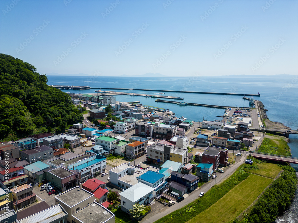Rausu, Hokkaido: Aerial drone view of the Rausu town and harbor in the Shiretoko peninsula in Hokkaido in summer in Japan