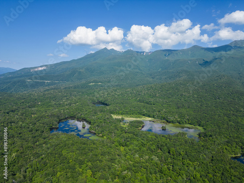 Shiretoko, Japan: Aerial drone view of the Shiretoko five lakes and dramatic coastline of the sea of Okhotsk in the Rausu mountain in Hokkaido on a sunny summer day in Japan. photo